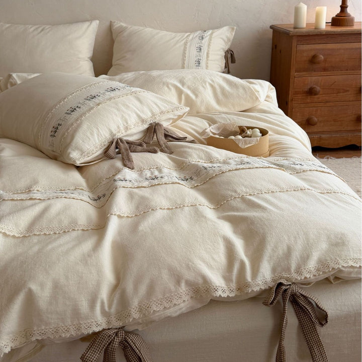 Luxurious cotton bedding set with floral embroidery and lace trim