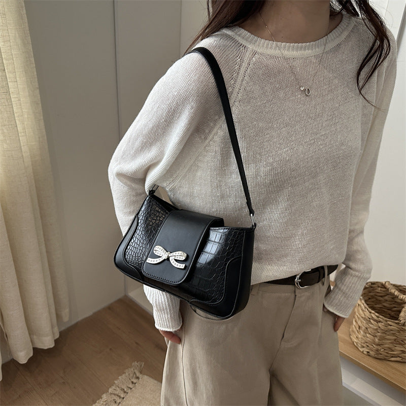 Elegant Crocodile-Patterned Handbag with Bow Detail