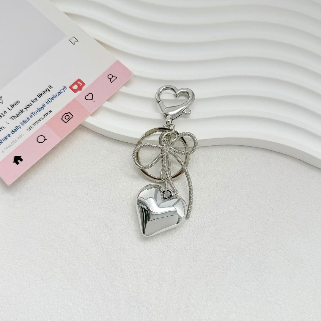 Heart-Shaped Metallic Keychain with Decorative Bow Stornfield