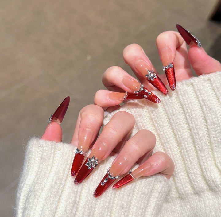 Artistic Stiletto Press-On Nail Art with Glimmering Accents Stornfield