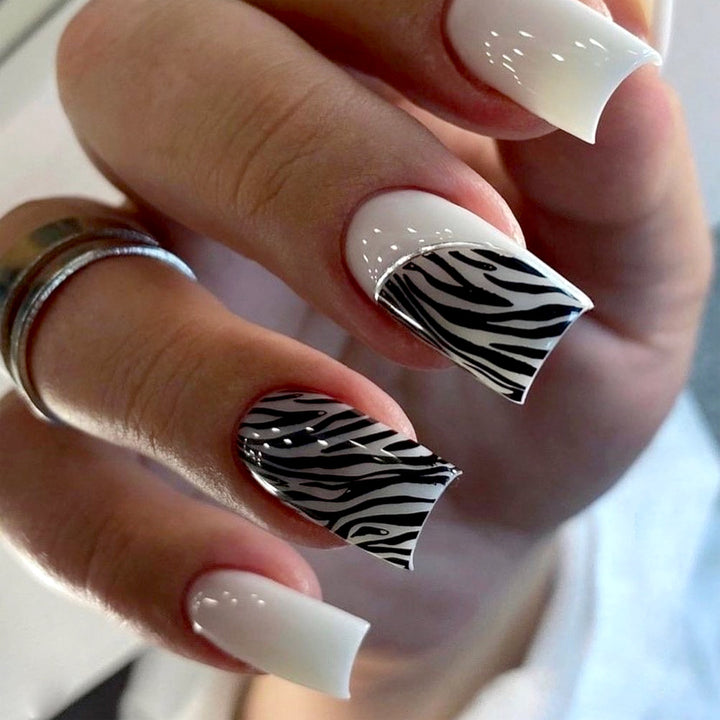 Artful nail extensions with stylish zebra pattern Stornfield