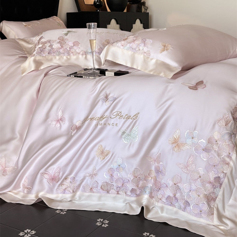 Luxurious satin bedding set with embroidered butterfly and flower appliqués
