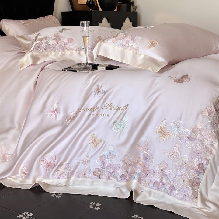 Luxurious satin bedding set with embroidered butterfly and flower appliqués