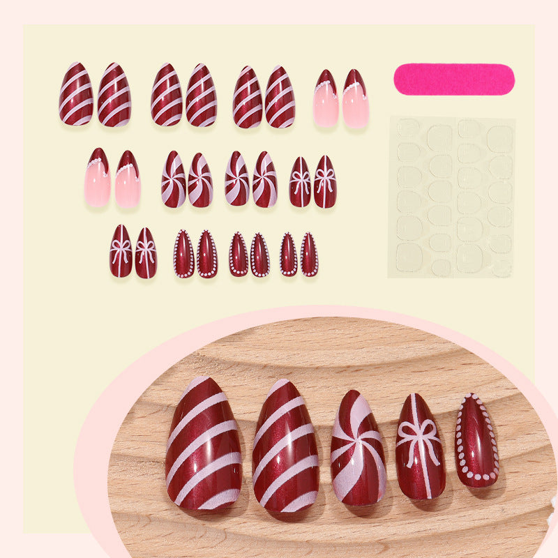 artfully designed nail set with festive candy cane motifs Stornfield