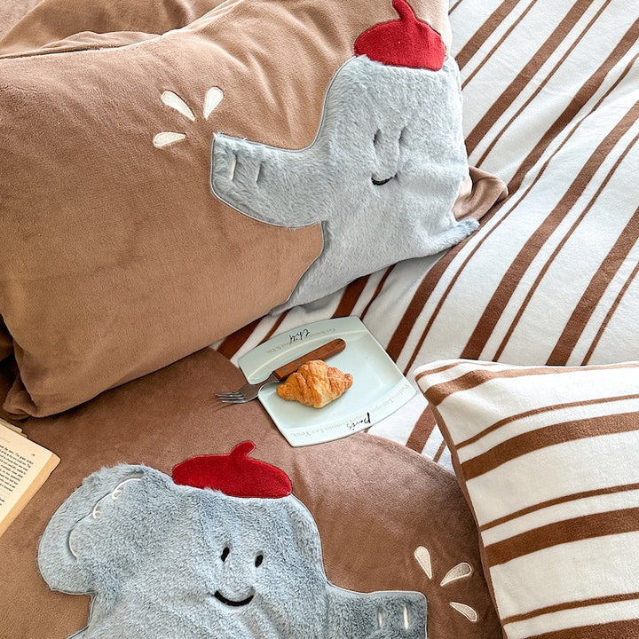 Quilted bedding and throw blanket set with check stitching, velvet texture, and floral appliqué