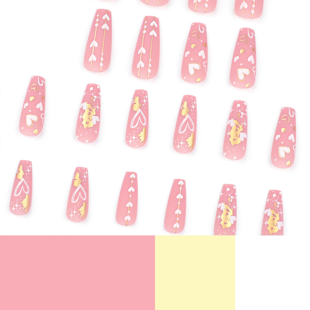 Artificial nail art with heart and glitter designs Stornfield