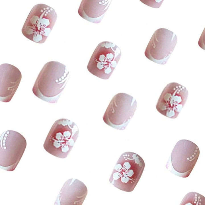 Acrylic nail set with elegant flower and French tip designs Stornfield