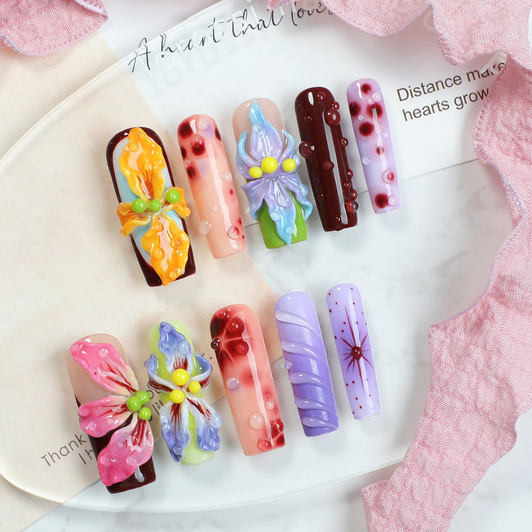 Creative artificial nail set with elegant floral design and glitter accents Stornfield