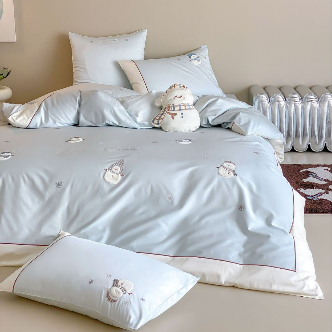 Luxurious bedding set with embroidered snowman appliqués and brushed satin