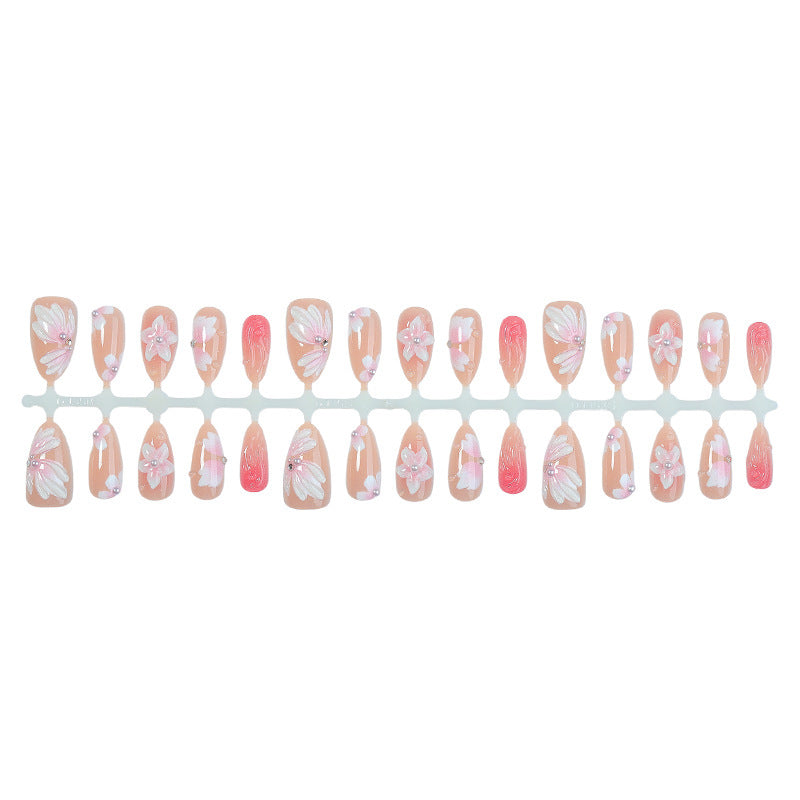 Artificial nail set with floral motifs and rhinestone decorations Stornfield