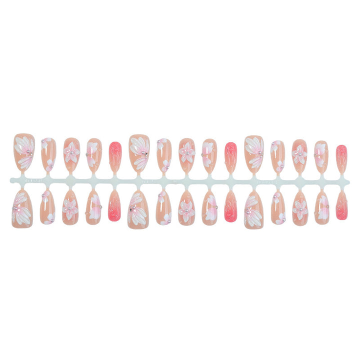 Artificial nail set with floral motifs and rhinestone decorations Stornfield