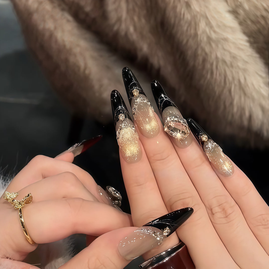 Glamorous artificial nails with extravagant rhinestone and glitter insets Stornfield