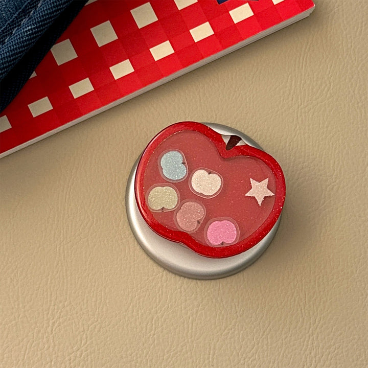 Funnier apple motif smartphone finger holder Stornfield