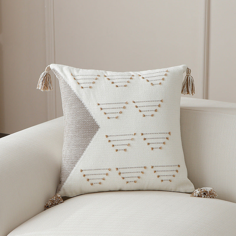 Decorative woven cushion cover with geometric tuft-relief and tassels Stornfield