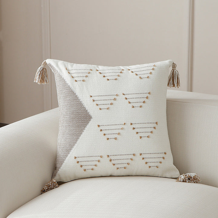 Decorative woven cushion cover with geometric tuft-relief and tassels Stornfield