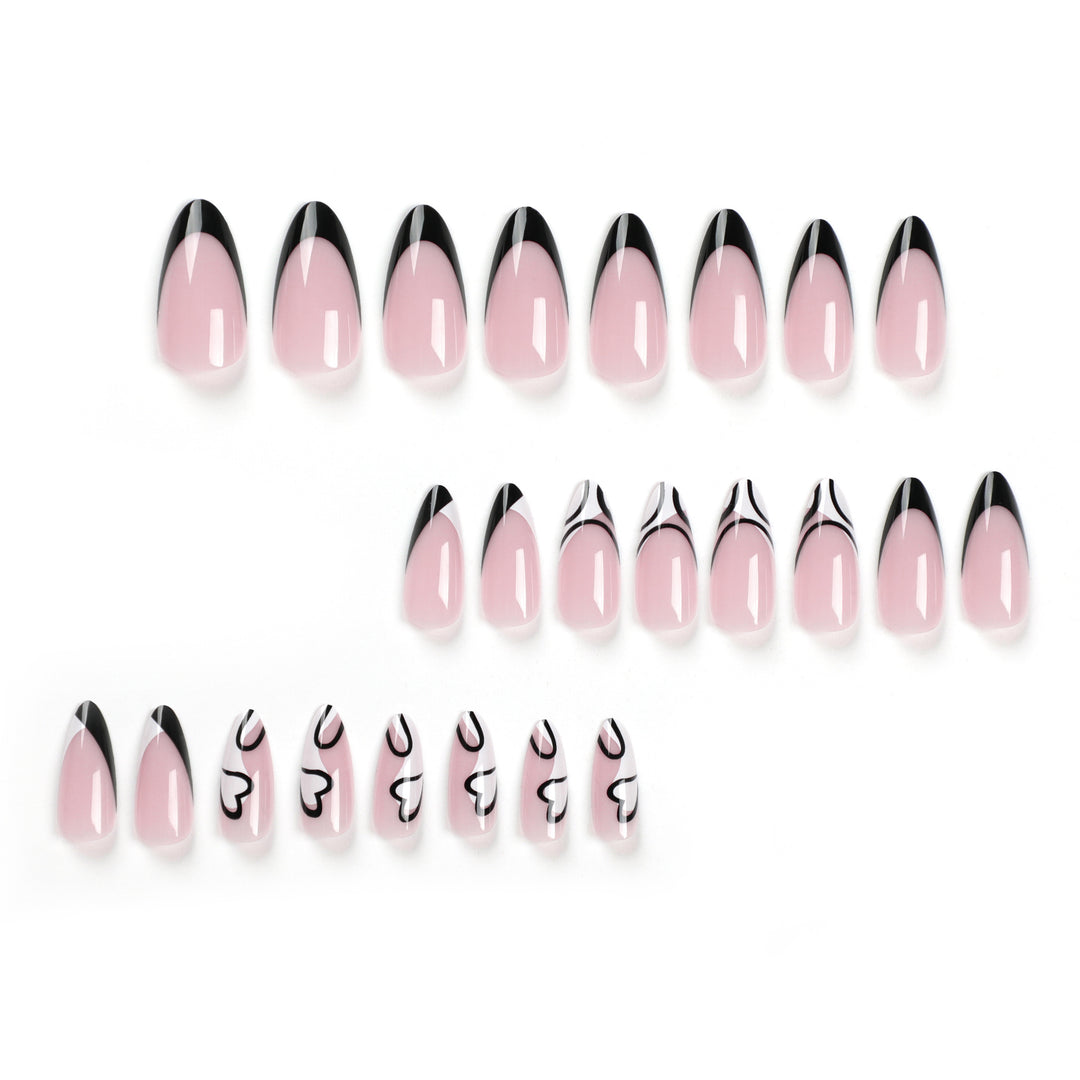 Artful stiletto nails with elegant black-and-white design Stornfield