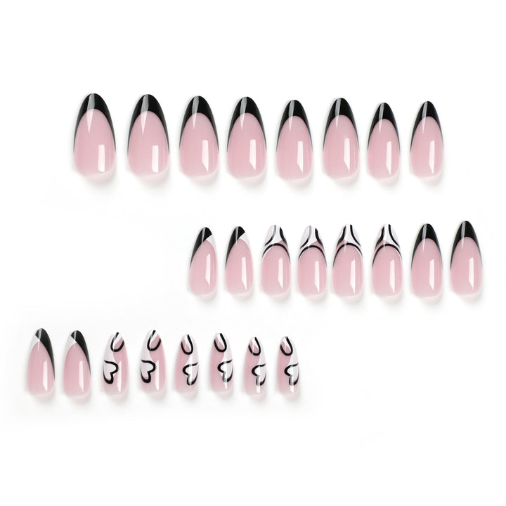Artful stiletto nails with elegant black-and-white design Stornfield