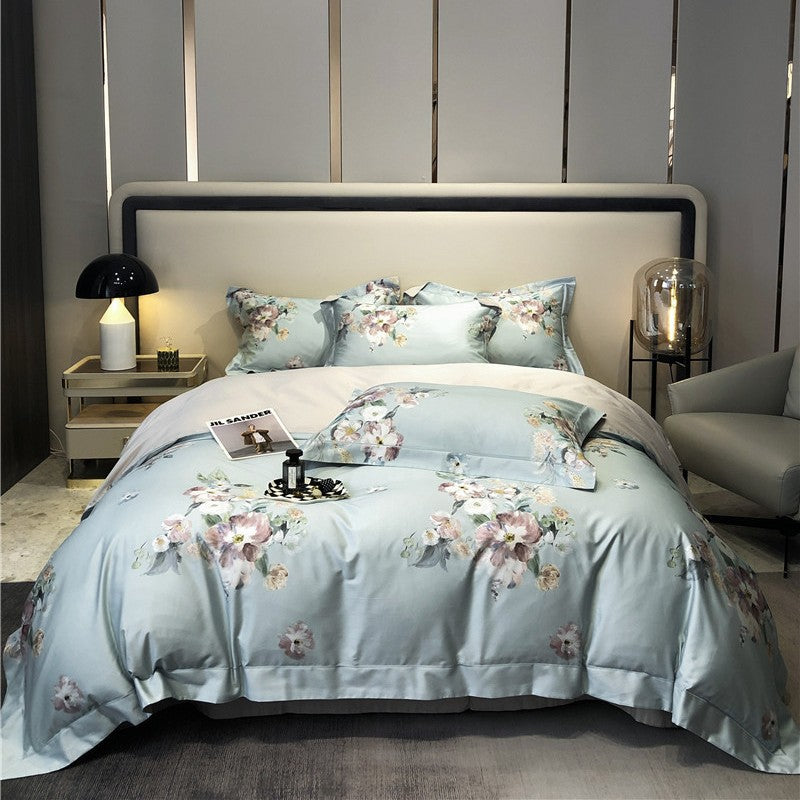 Cotton satin bedding set with watercolor flower print and reversible blanket