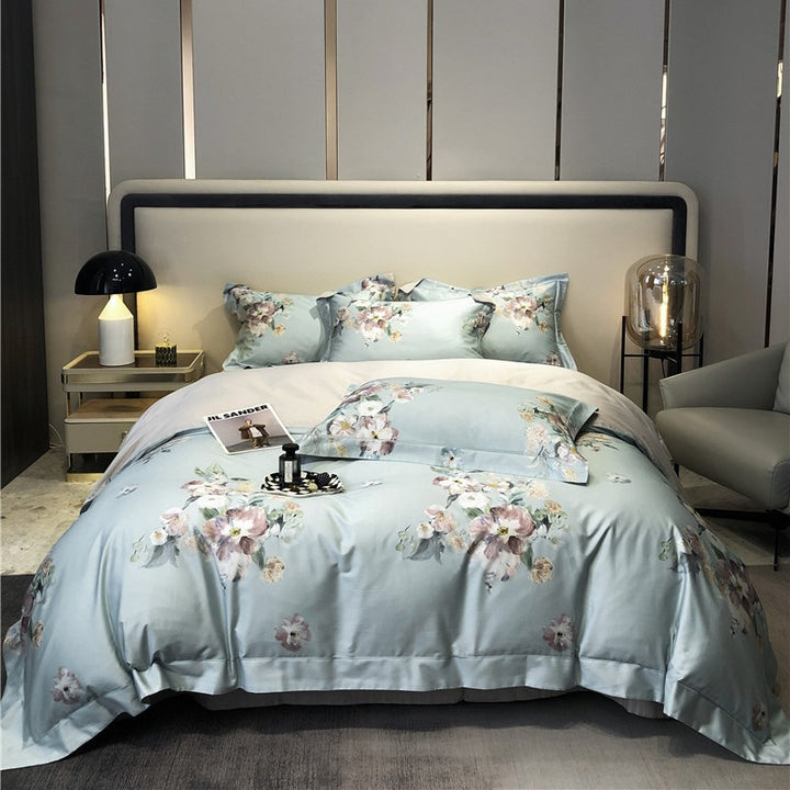 Cotton satin bedding set with watercolor flower print and reversible blanket