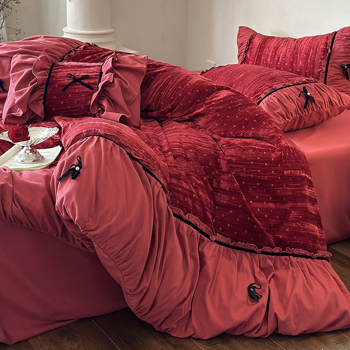 Bedding set made of velvety microfiber with ruffles, decorative ribbons, and quilted texture
