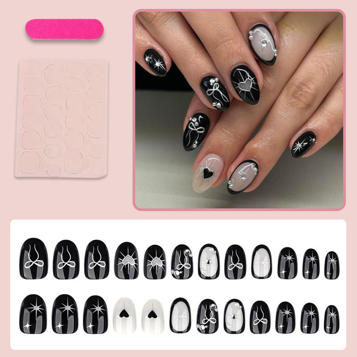 Artificial nail set with elegant bow and heart design Stornfield