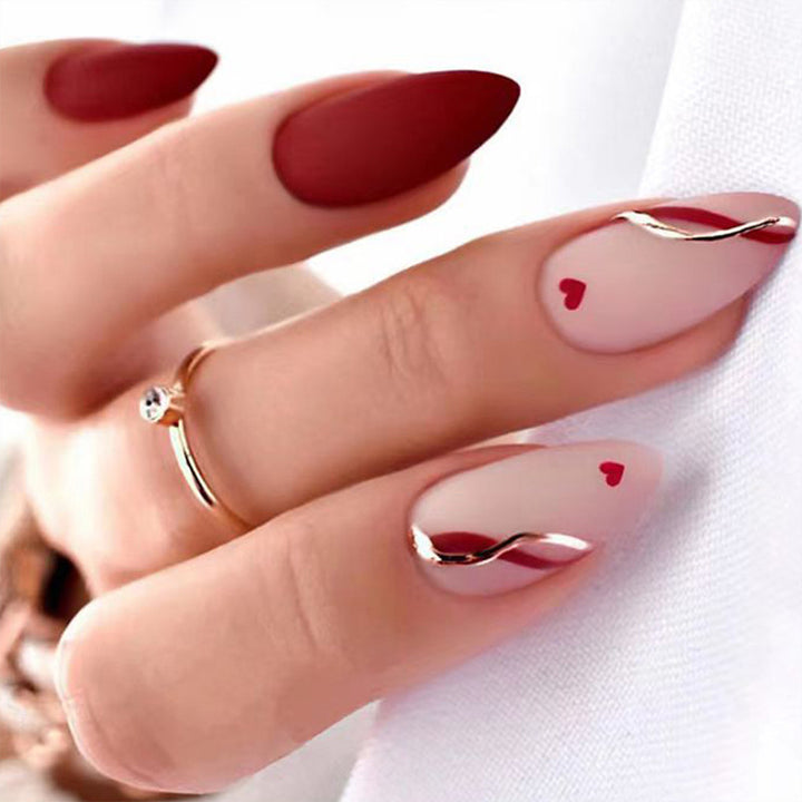 Artful stiletto nails with heart-shaped accents Stornfield