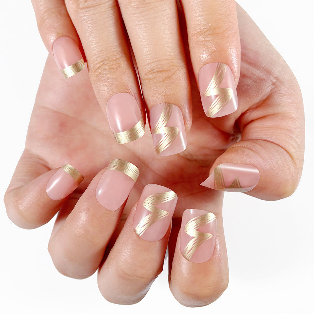 Elegant French Tip Press-On Nails with Gold Accents Stornfield