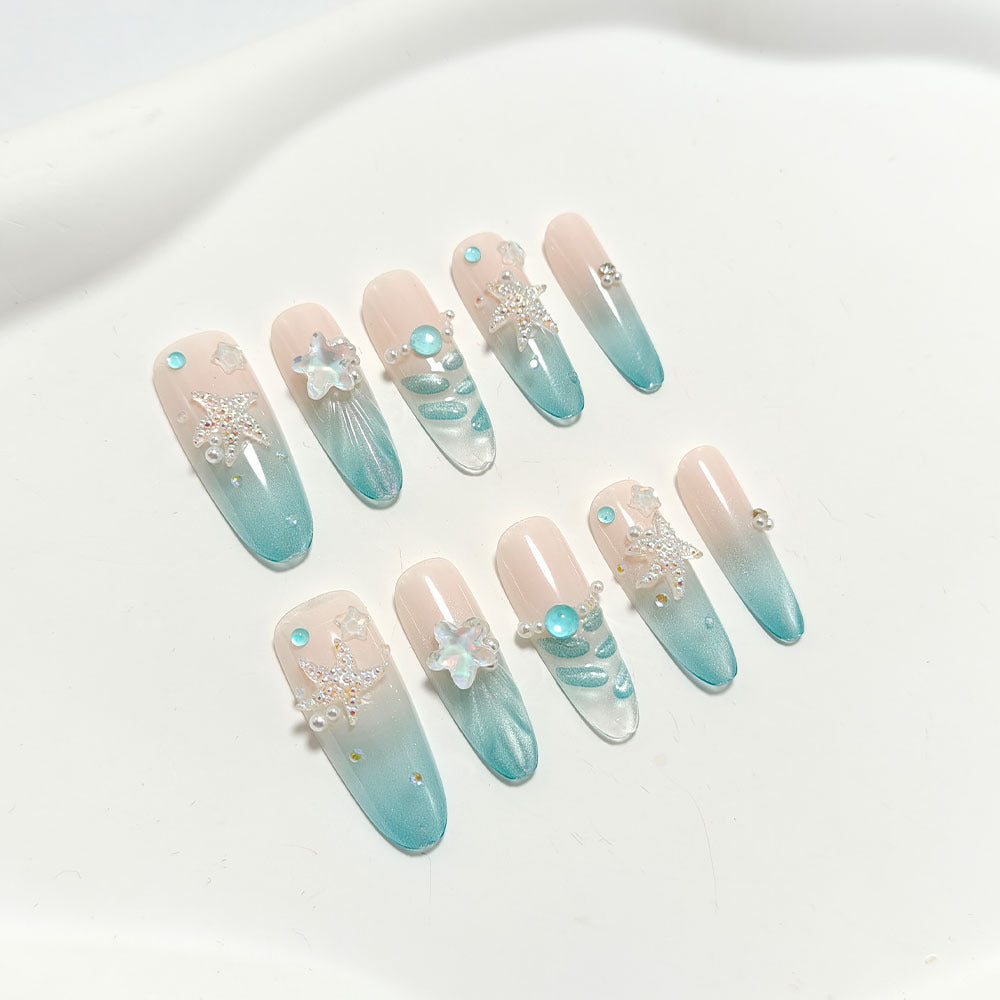 Elegant Nail Art with Ocean Theme and 3D Accents Stornfield