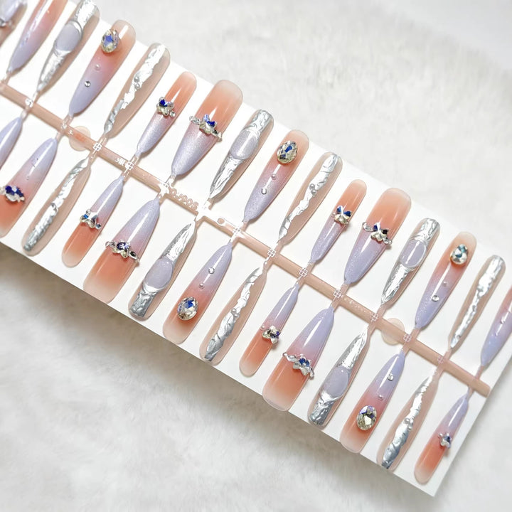 Artificial nails with elegant glitter design and fine 3D decorations Stornfield