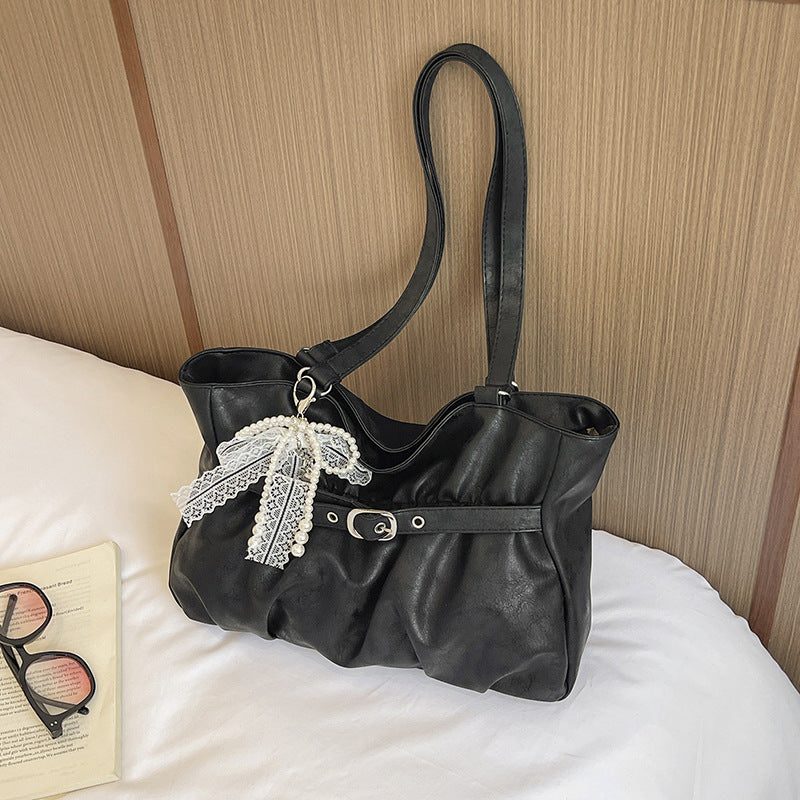 Elegant Leather Tote Bag with Decorative Accents