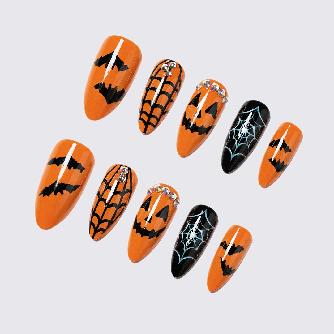 Acrylic nail set with Halloween designs and glitter elements Stornfield