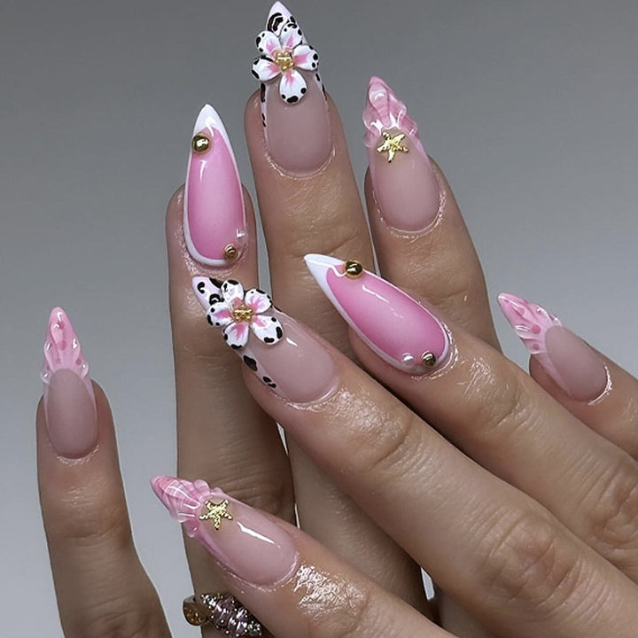 Artistic nail extensions with floral accents and glitter Stornfield