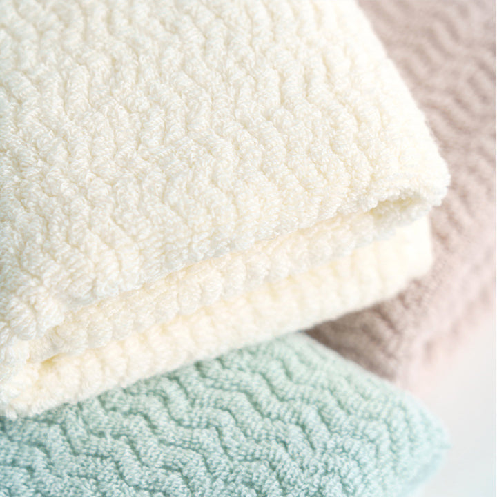 High-quality terry towel with dense pile and decorative zigzag border