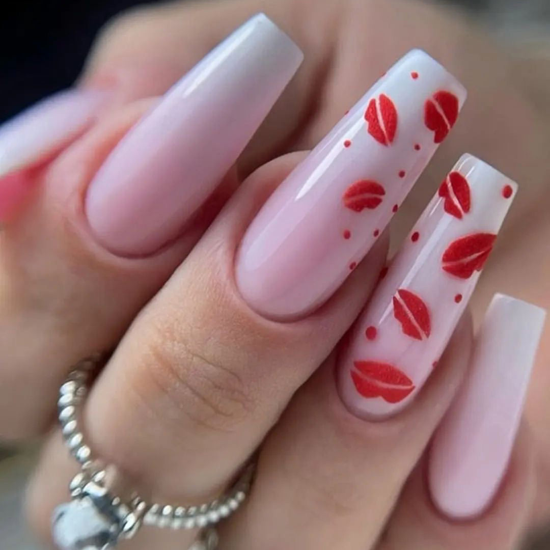 Artistic stiletto nails with lip motifs Stornfield