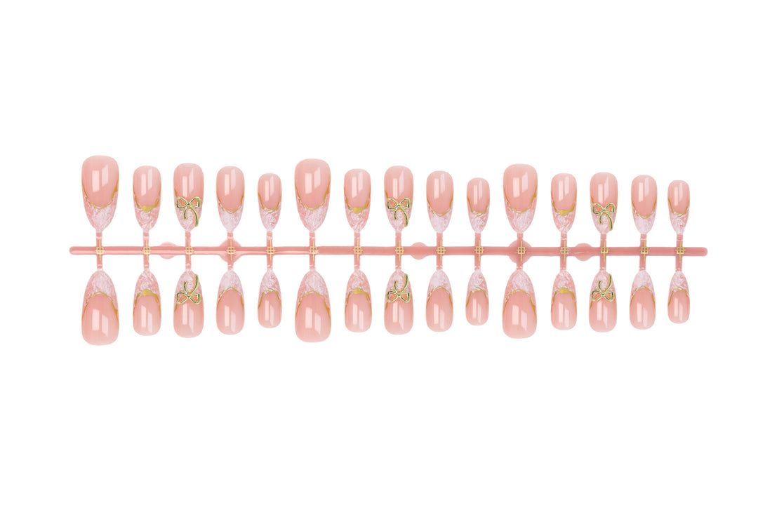 Acrylic nail set with elegant tips and delicate embellishments Stornfield