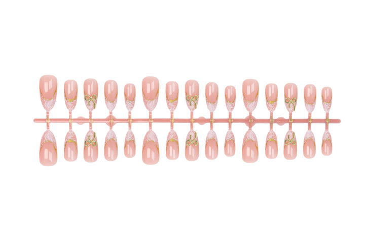 Acrylic nail set with elegant tips and delicate embellishments Stornfield