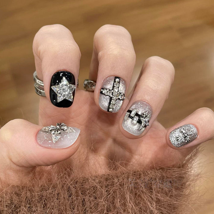 Glamorous artificial nails with rhinestone and glitter motifs Stornfield