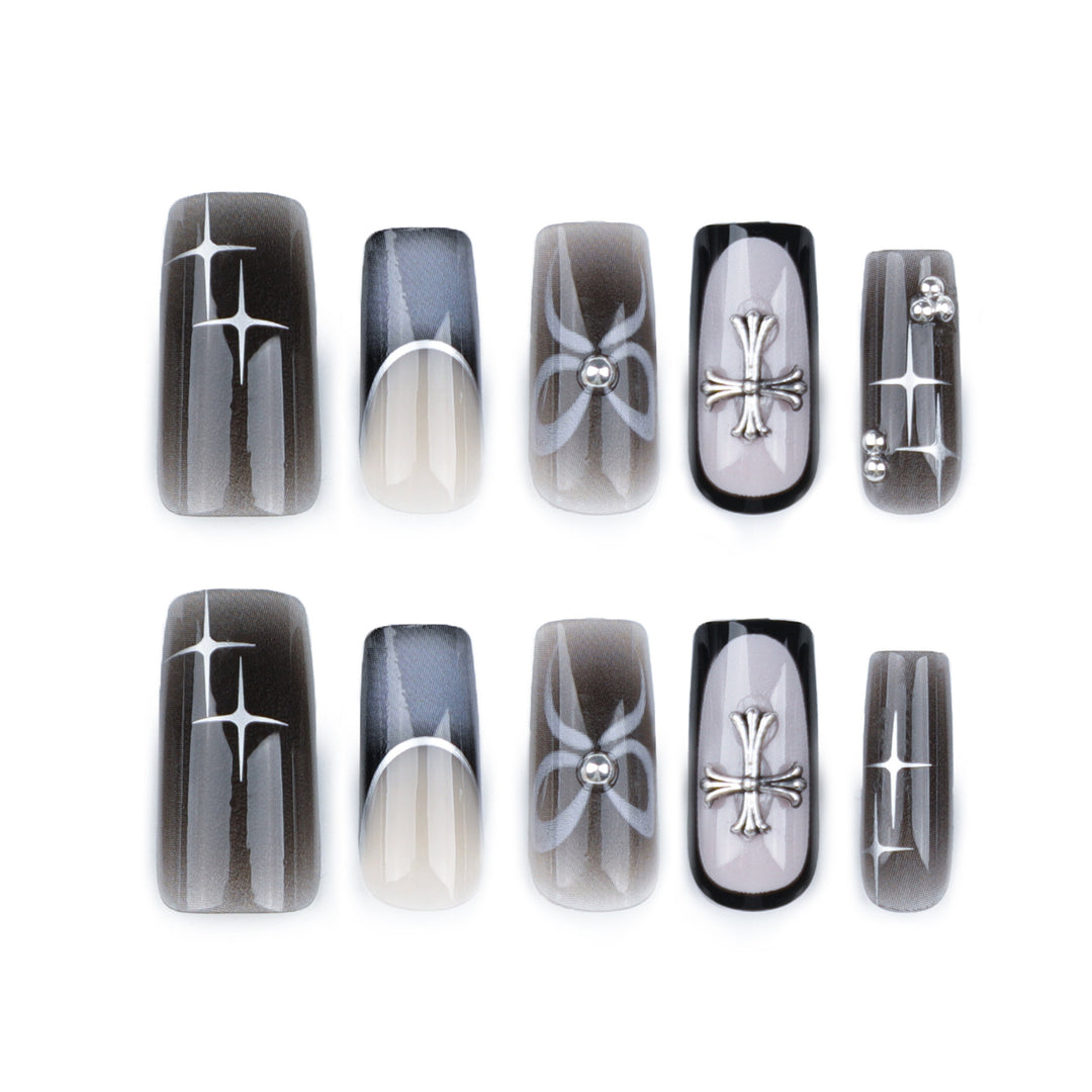 Artful acrylic nails with unique jewelry embellishments Stornfield