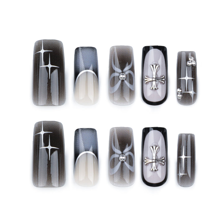 Artful acrylic nails with unique jewelry embellishments Stornfield