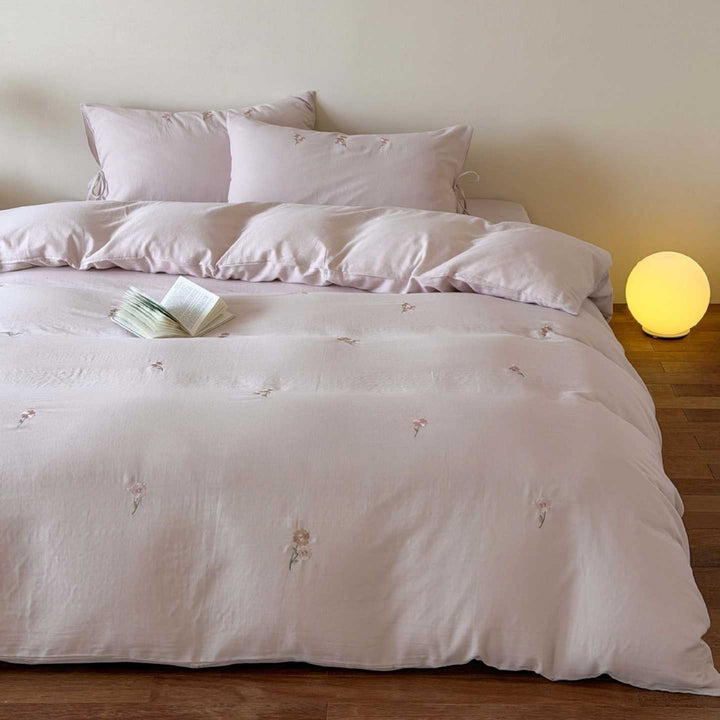Breathable cotton bedding set with delicate flower embroidery and tie ribbon pillow
