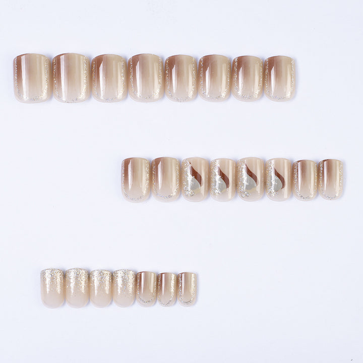 Elegant Nail Art with Glitter and Stylish Accents Stornfield