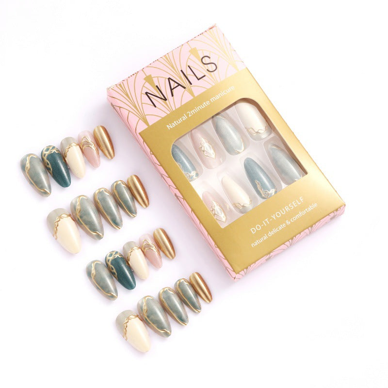 Artificial nails with elegant golden accents Stornfield