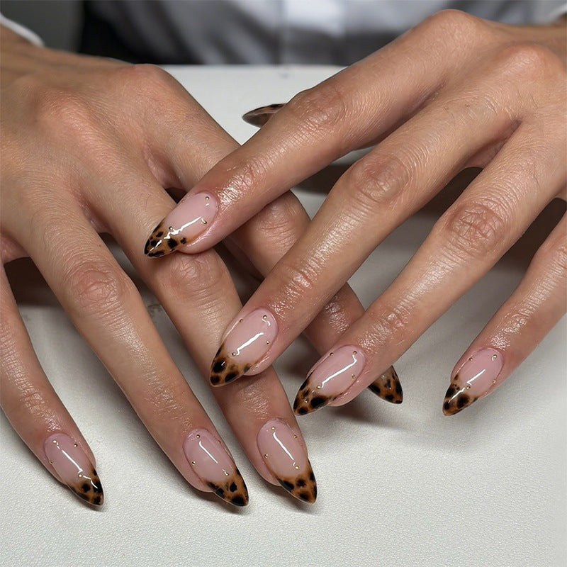 Acrylic nail set with elegant leopard design and gold accents Stornfield
