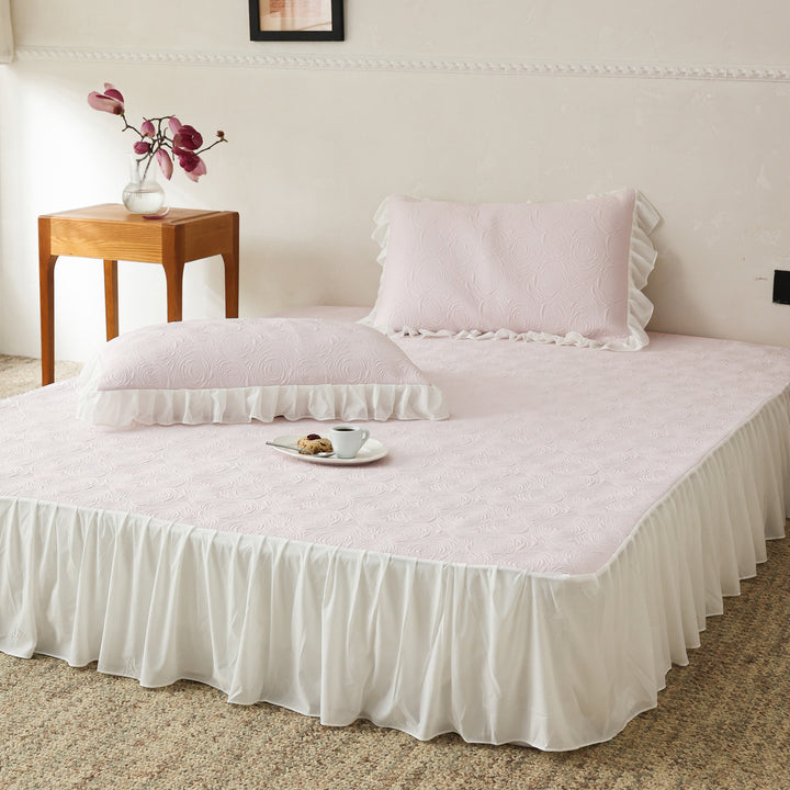 Bedding set with quilted mattress topper and ruffled skirt