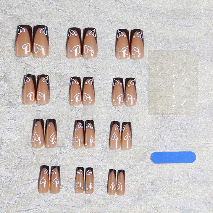 Elegant artificial nails with heart pattern and glitter accents Stornfield