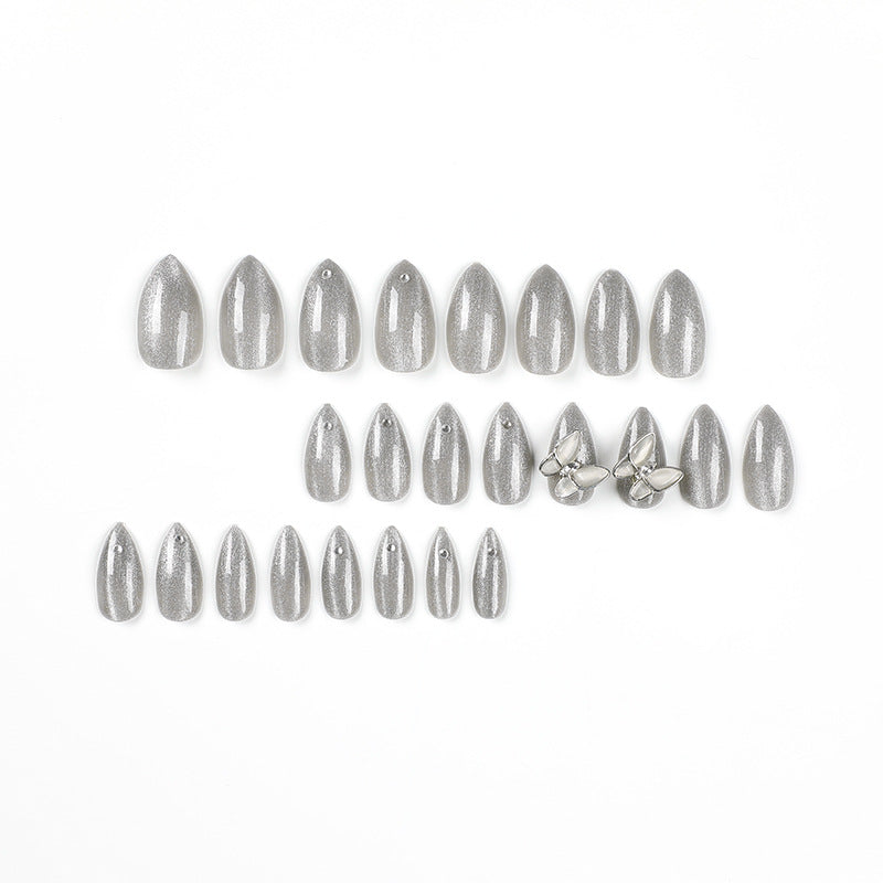 Glamorous stiletto nails with radiant glitter and elegant 3D design Stornfield