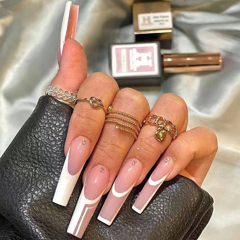 Artificial nails with elegant geometric designs and glossy finish Stornfield