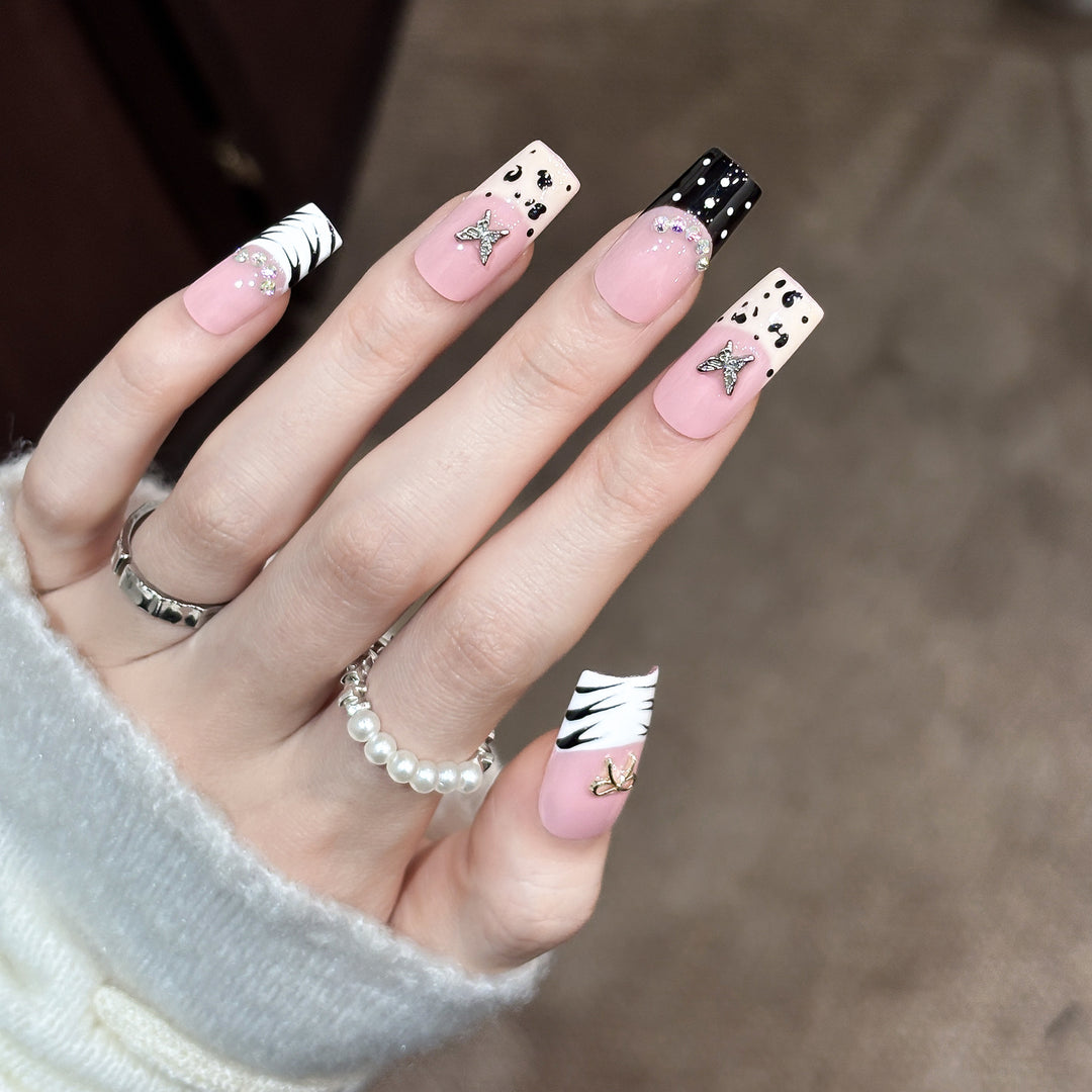 Artistic Press-On Nail Enhancements with Pattern and Gem Accents