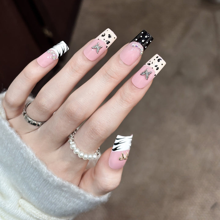 Artistic Press-On Nail Enhancements with Pattern and Gem Accents