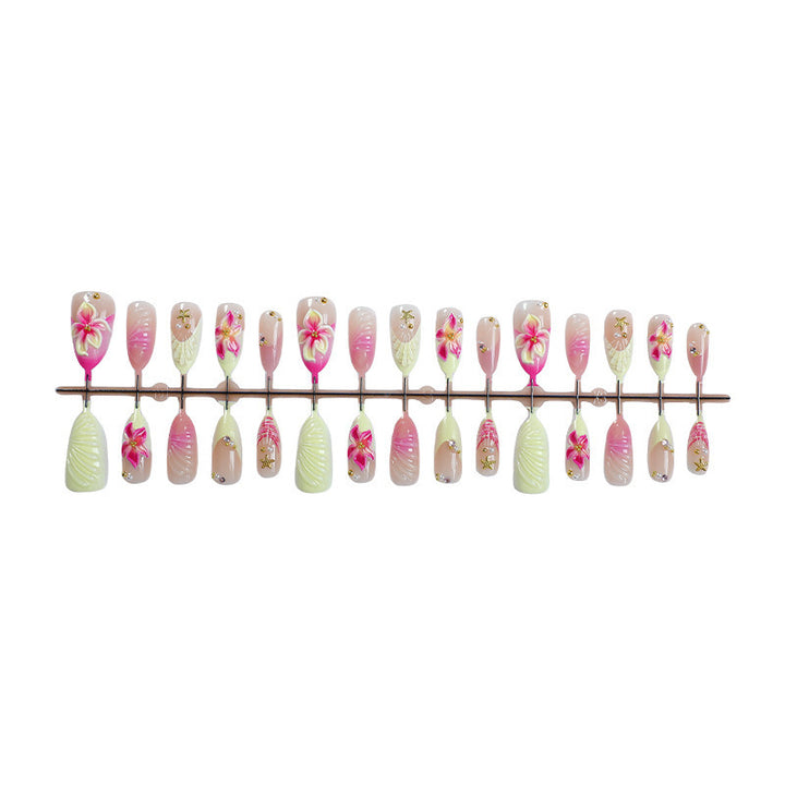 Creative acrylic nail set with floral accents and glitter decorations Stornfield